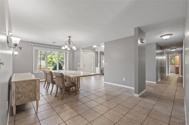 6924 Todd Way, Salina, NY 13088 - dining space with a chandelier and light tile patterned flooring