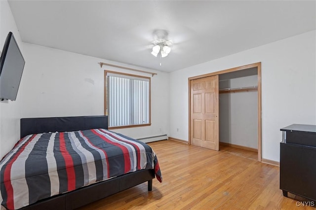 6924 Todd Way, Salina, NY 13088 - bedroom with light wood-style flooring, baseboard heating, a closet, and a ceiling fan