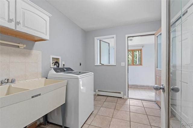 6924 Todd Way, Salina, NY 13088 - laundry room with a baseboard radiator, washer / clothes dryer, cabinet space, and light tile patterned flooring