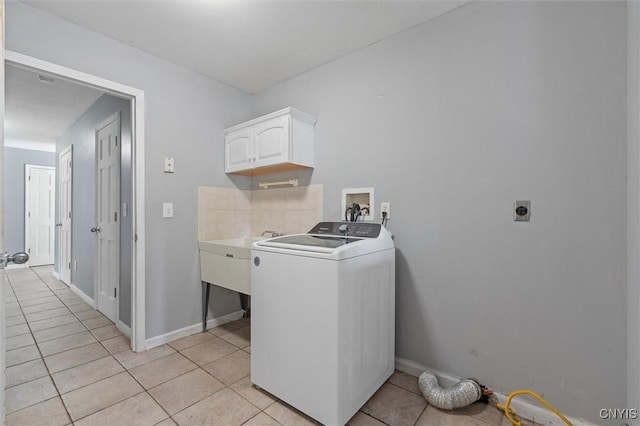 6924 Todd Way, Salina, NY 13088 - laundry room with washer / clothes dryer, cabinet space, and light tile patterned floors