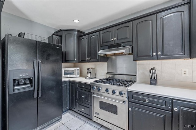 6924 Todd Way, Salina, NY 13088 - kitchen with black refrigerator with ice dispenser, under cabinet range hood, luxury range, light tile patterned flooring, and light countertops