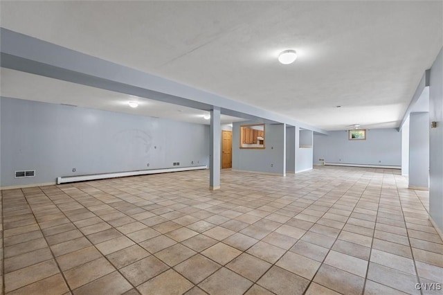 6924 Todd Way, Salina, NY 13088 - finished below grade area with a baseboard radiator, light tile patterned flooring, and baseboard heating