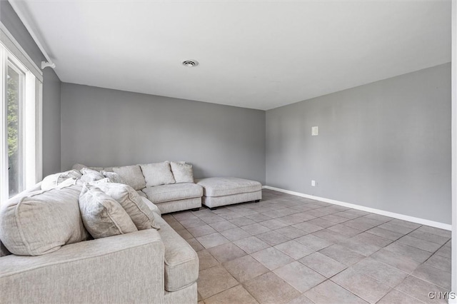 6924 Todd Way, Salina, NY 13088 - living room with baseboards and light tile patterned floors