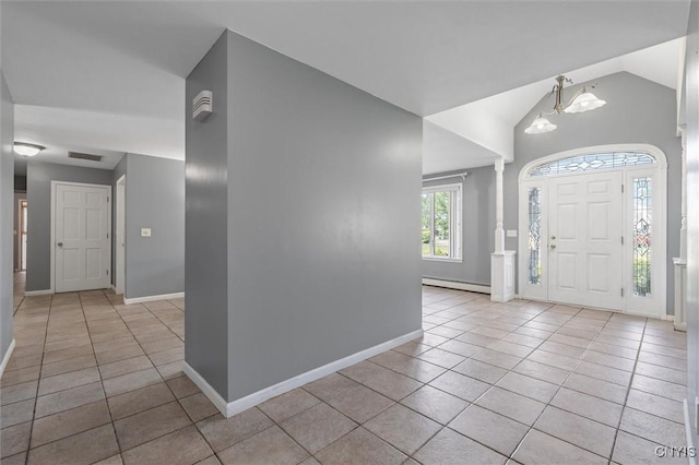 6924 Todd Way, Salina, NY 13088 - foyer with a baseboard radiator, light tile patterned flooring, vaulted ceiling, a chandelier, and decorative columns