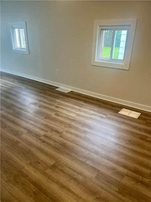 232 Almay Rd, Greece, NY 14616 - unfurnished room with dark wood finished floors and baseboards