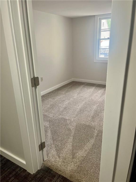232 Almay Rd, Greece, NY 14616 - empty room with dark carpet and baseboards