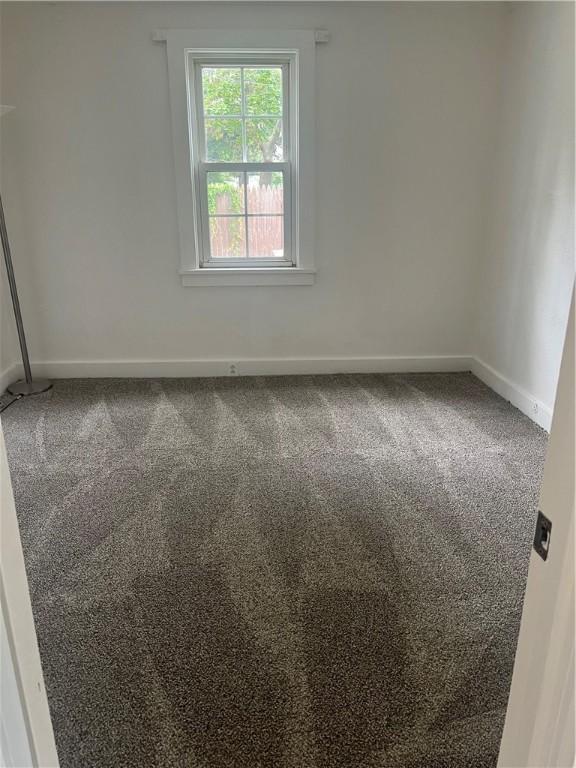 232 Almay Rd, Greece, NY 14616 - carpeted empty room featuring baseboards
