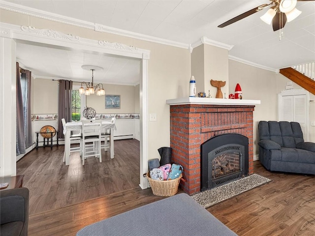5631 W Blf, Newfane, NY 14126 - living area with ornamental molding, wood finished floors, ceiling fan, a fireplace, and a chandelier