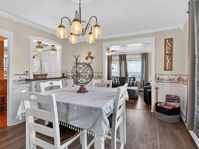 5631 W Blf, Newfane, NY 14126 - dining room featuring ornamental molding, dark wood-type flooring, a chandelier, wainscoting, and a ceiling fan