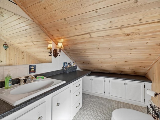 5631 W Blf, Newfane, NY 14126 - bathroom with wooden ceiling, vanity, vaulted ceiling, and wooden walls