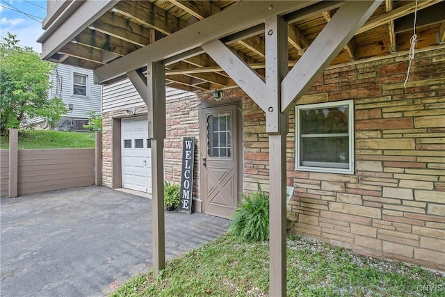 229 Gillespie Ave, Camillus, NY 13219 - entrance to property featuring a garage and stone siding