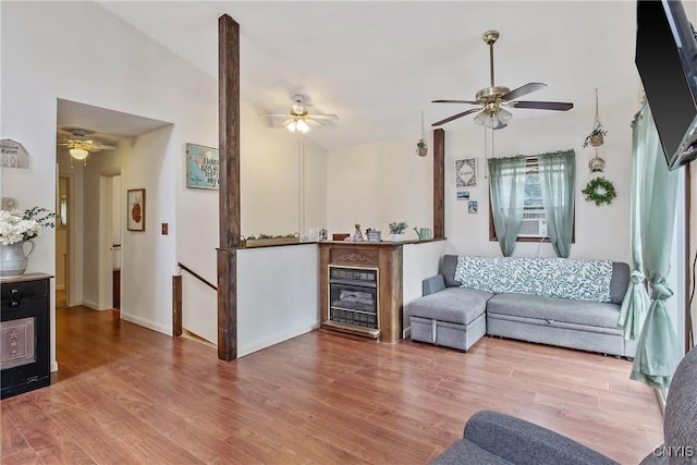 229 Gillespie Ave, Camillus, NY 13219 - living room with ceiling fan, wood finished floors, and a fireplace