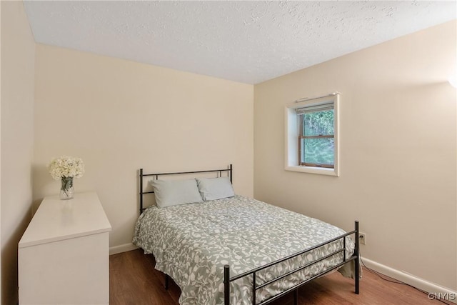229 Gillespie Ave, Camillus, NY 13219 - bedroom featuring wood finished floors and a textured ceiling