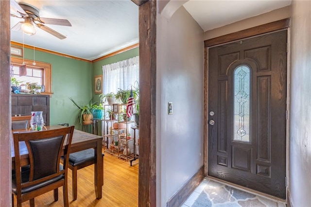 82 Barnard St, Greece, NY 14616 - foyer with a ceiling fan, arched walkways, and light wood finished floors