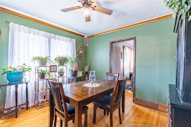 82 Barnard St, Greece, NY 14616 - dining room with a ceiling fan, light wood finished floors, and ornamental molding