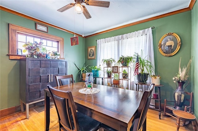 82 Barnard St, Greece, NY 14616 - dining room with wood finished floors, a ceiling fan, and ornamental molding