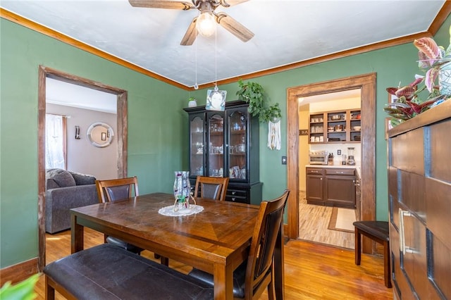 82 Barnard St, Greece, NY 14616 - dining space with light wood-style floors, ceiling fan, and crown molding