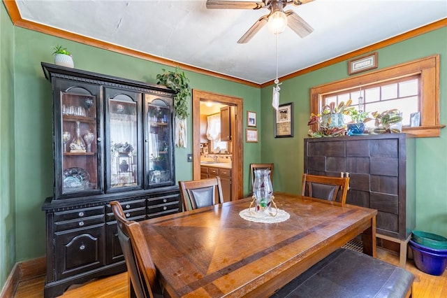 82 Barnard St, Greece, NY 14616 - dining space featuring ceiling fan, light wood-style floors, and ornamental molding