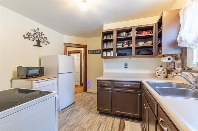 82 Barnard St, Greece, NY 14616 - kitchen featuring white appliances, light wood finished floors, light countertops, dark brown cabinetry, and open shelves