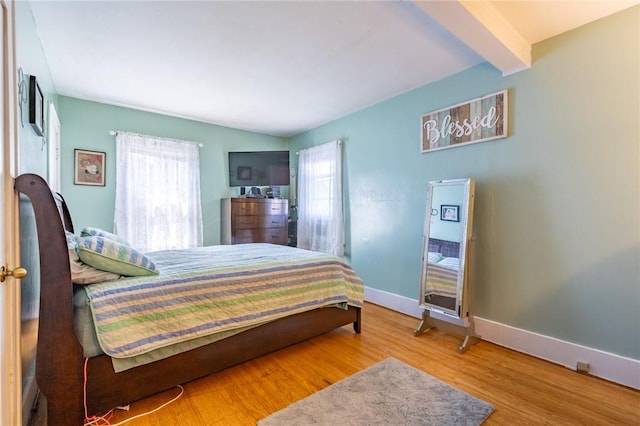 82 Barnard St, Greece, NY 14616 - bedroom with multiple windows, wood finished floors, and beam ceiling