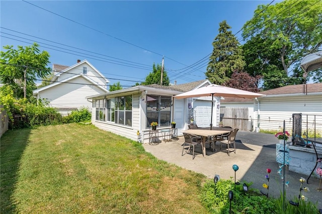 82 Barnard St, Greece, NY 14616 - rear view of property featuring a sunroom and a patio