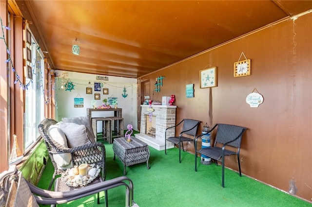 82 Barnard St, Greece, NY 14616 - living area featuring carpet floors and a fireplace with raised hearth