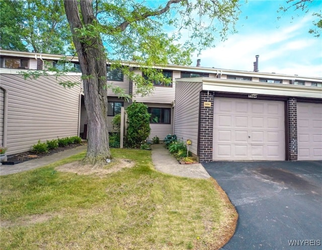 1104 Netherton Ct, Amherst, NY 14051 - mid-century inspired home featuring a garage, driveway, a front yard, and brick siding