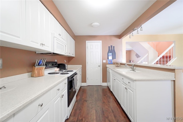 1104 Netherton Ct, Amherst, NY 14051 - kitchen featuring white appliances, light countertops, white cabinetry, dark wood finished floors, and a peninsula