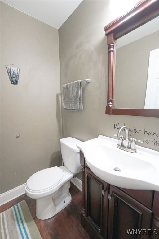 1104 Netherton Ct, Amherst, NY 14051 - half bathroom featuring vanity and wood finished floors