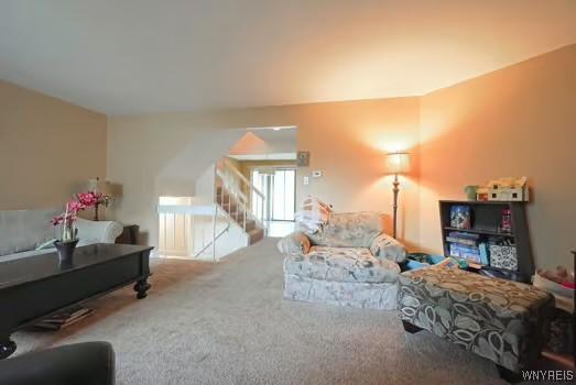 1104 Netherton Ct, Amherst, NY 14051 - carpeted living room with stairs