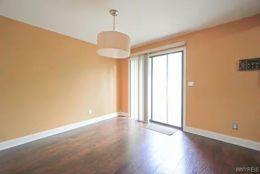 1104 Netherton Ct, Amherst, NY 14051 - empty room featuring dark wood-style floors and baseboards