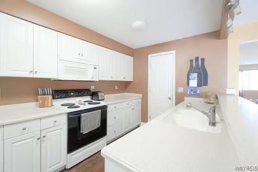 1104 Netherton Ct, Amherst, NY 14051 - kitchen featuring white appliances, white cabinets, and light countertops