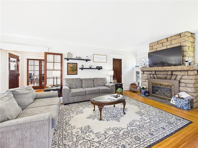 1010 W Main St, Smethport Boro, PA 16749 - living area with wood finished floors and a stone fireplace
