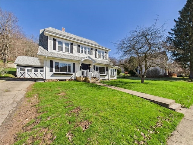 1010 W Main St, Smethport Boro, PA 16749 - view of front of house featuring asphalt driveway, a front lawn, a chimney, and roof with shingles