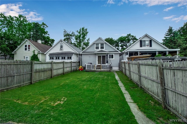 1007 87th St, Niagara Falls, NY 14304 - rear view of house with a fenced backyard and a deck