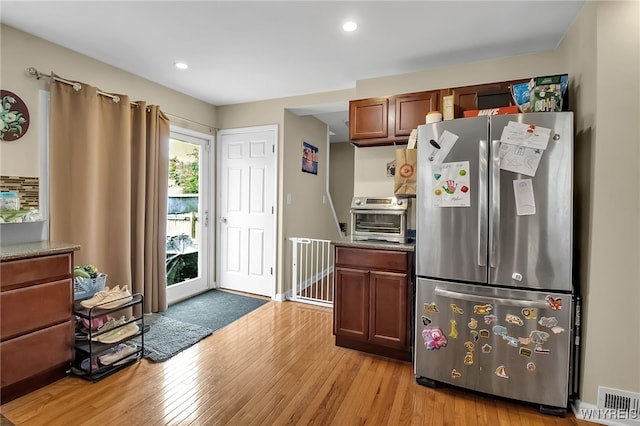 1007 87th St, Niagara Falls, NY 14304 - kitchen featuring freestanding refrigerator, light wood-style flooring, recessed lighting, and brown cabinetry
