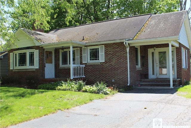 410 Chestnut St, Pomfret, NY 14063 - view of front of home featuring brick siding, a front lawn, and a shingled roof