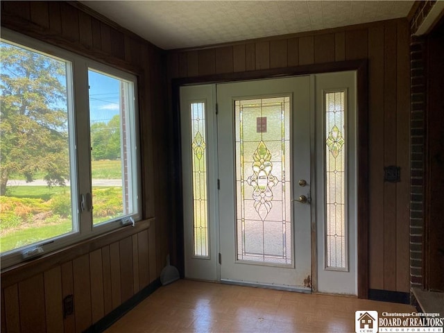 410 Chestnut St, Pomfret, NY 14063 - foyer with wood walls and light flooring