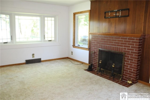 410 Chestnut St, Pomfret, NY 14063 - unfurnished living room with carpet floors and a brick fireplace