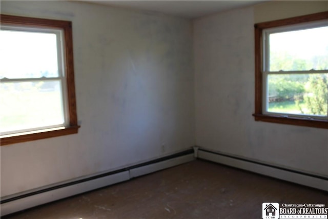 410 Chestnut St, Pomfret, NY 14063 - empty room with healthy amount of natural light and a baseboard radiator