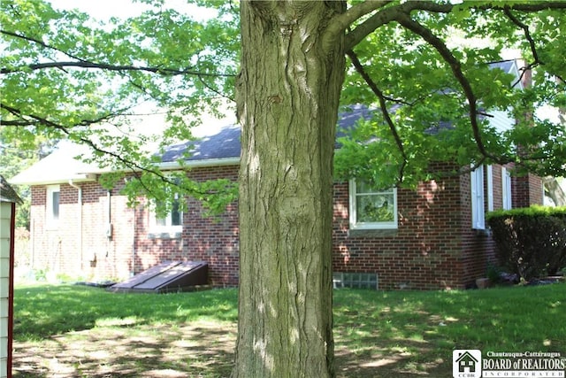 410 Chestnut St, Pomfret, NY 14063 - view of side of property with brick siding and a lawn