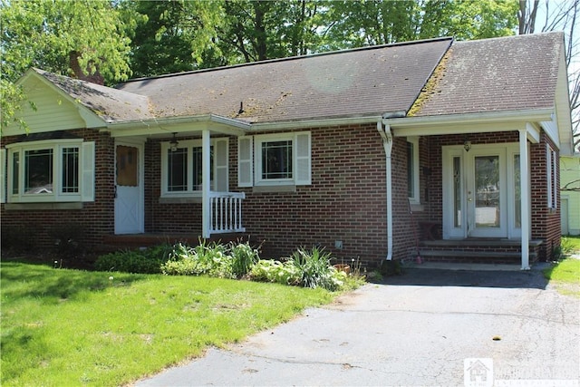 410 Chestnut St, Pomfret, NY 14063 - single story home with brick siding, a front yard, and roof with shingles