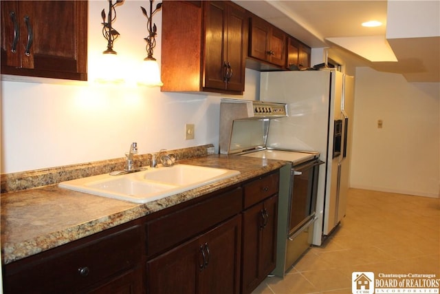 410 Chestnut St, Pomfret, NY 14063 - kitchen featuring light tile patterned floors, hanging light fixtures, light stone counters, and recessed lighting