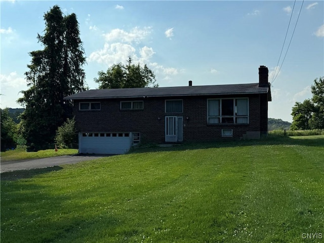 2359 Sands Rd, Camillus, NY 13031 - view of front of house featuring a garage, asphalt driveway, a chimney, a front yard, and brick siding