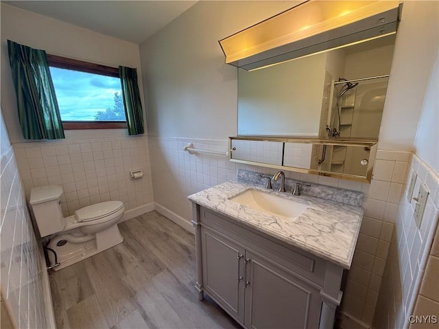 2359 Sands Rd, Camillus, NY 13031 - full bath with tile walls, vanity, wainscoting, a shower, and wood finished floors