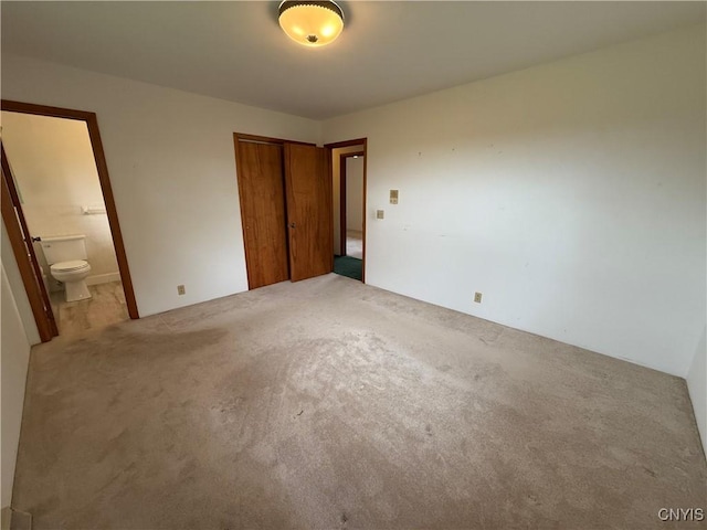2359 Sands Rd, Camillus, NY 13031 - unfurnished bedroom featuring a closet, carpet flooring, and ensuite bathroom