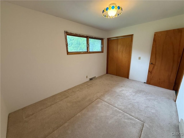 2359 Sands Rd, Camillus, NY 13031 - unfurnished bedroom featuring carpet and a closet