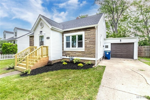 539 Windermere Blvd, Amherst, NY 14226 - view of front facade featuring stone siding, concrete driveway, and roof with shingles