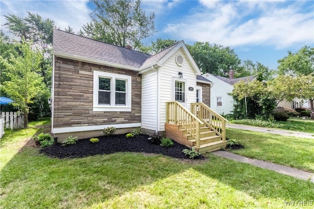539 Windermere Blvd, Amherst, NY 14226 - view of front of home with stone siding, a front yard, and a shingled roof