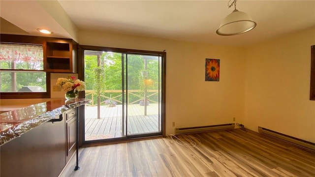 1221 Garden Ln, Middlesex, NY 14507 - doorway featuring a baseboard heating unit and light wood-style flooring